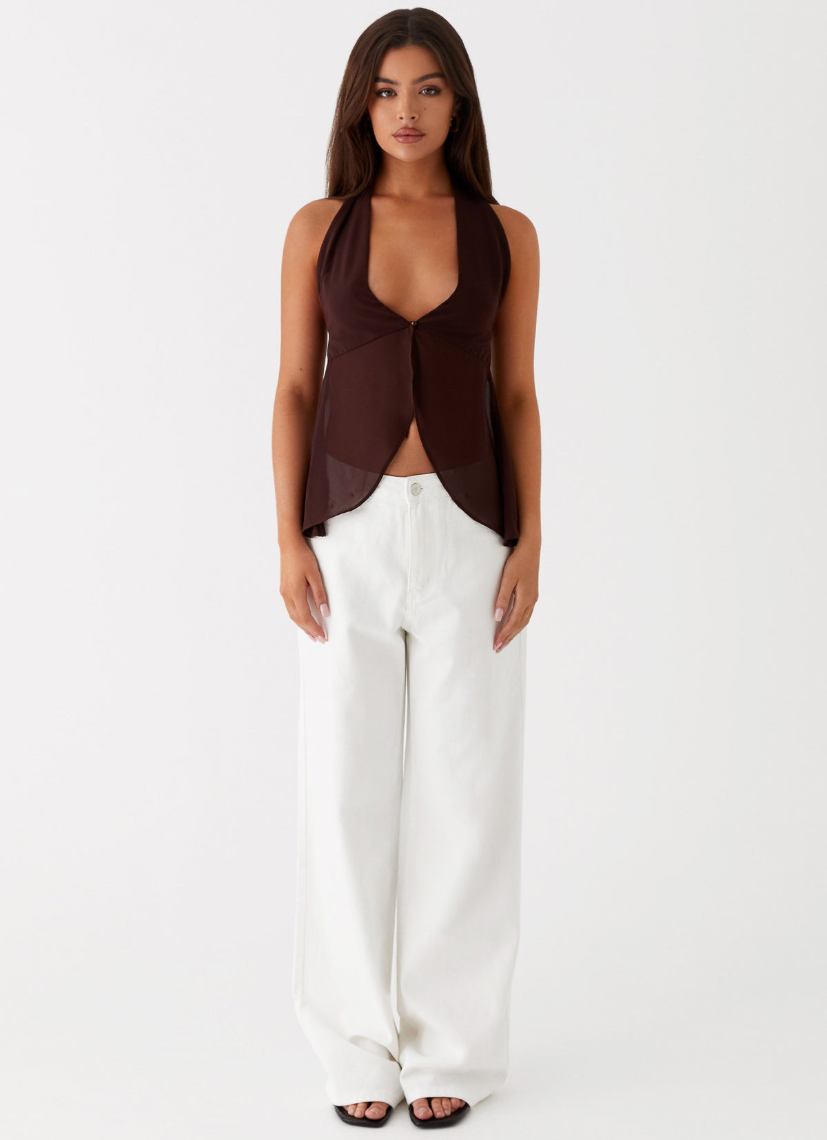 Womens Sass Wrap Mini Skirt  in the colour  Brown in front of the colour light grey