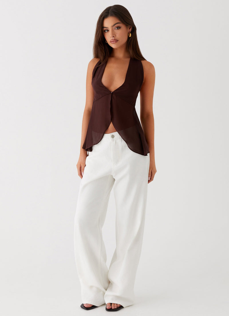Womens Sass Wrap Mini Skirt  in the colour  Brown in front of the colour light grey