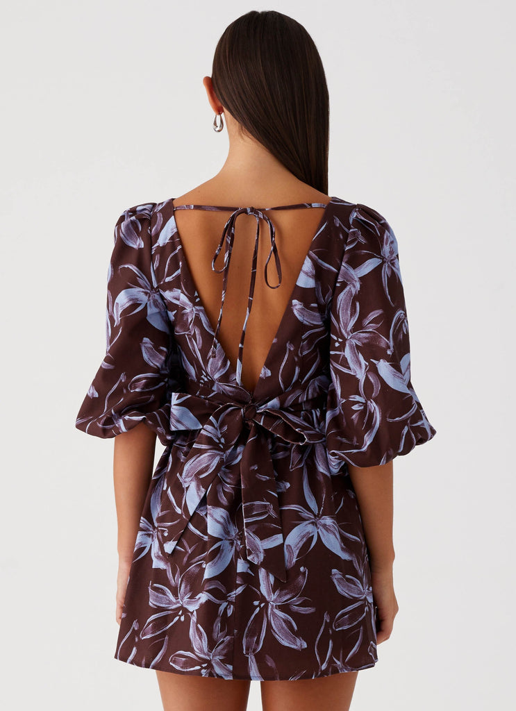 Womens Crystal Dreams Mini Dress in the colour Brown Purple Floral in front of a light grey background