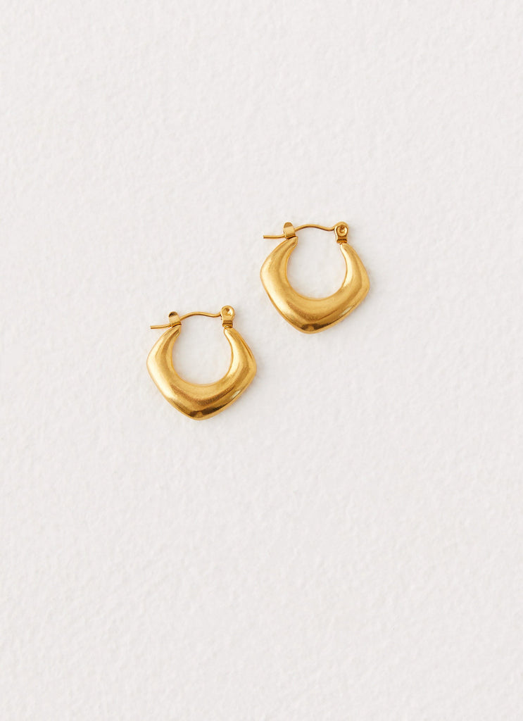Womens High Voltage Earrings in the colour Gold in front of a light grey background