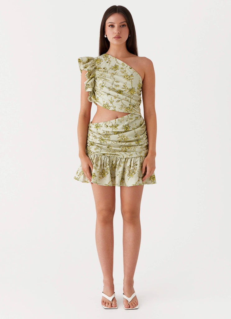 Womens Maisie Linen Mini Dress in the colour Sage Floral in front of a light grey background