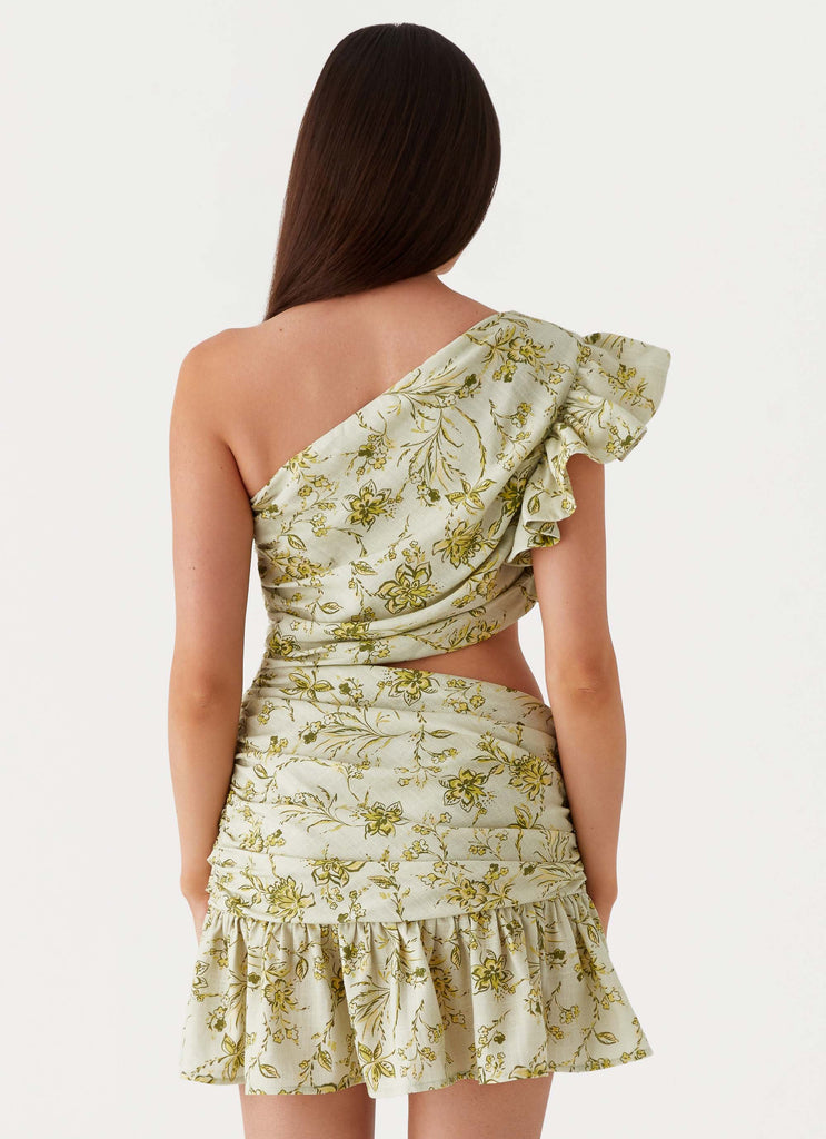 Womens Maisie Linen Mini Dress in the colour Sage Floral in front of a light grey background