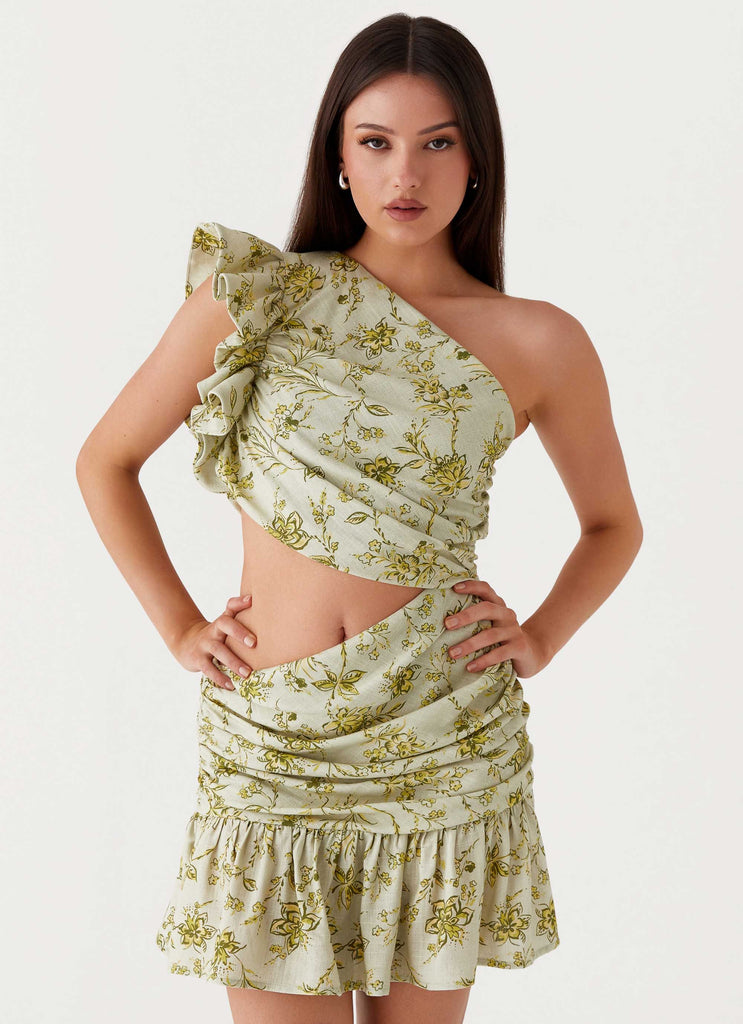 Womens Maisie Linen Mini Dress in the colour Sage Floral in front of a light grey background