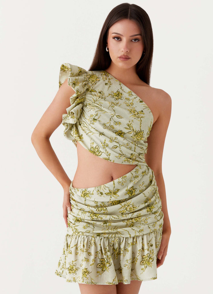 Womens Maisie Linen Mini Dress in the colour Sage Floral in front of a light grey background
