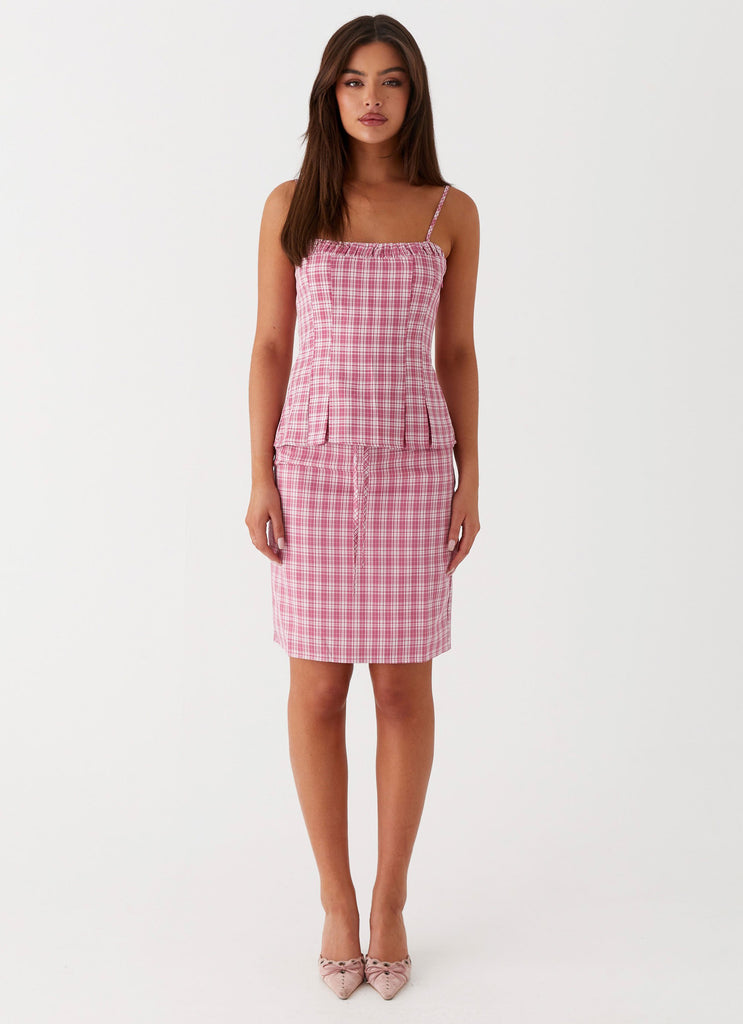 Womens Mamita Midi Skirt in the colour Pink Check in front of a light grey background