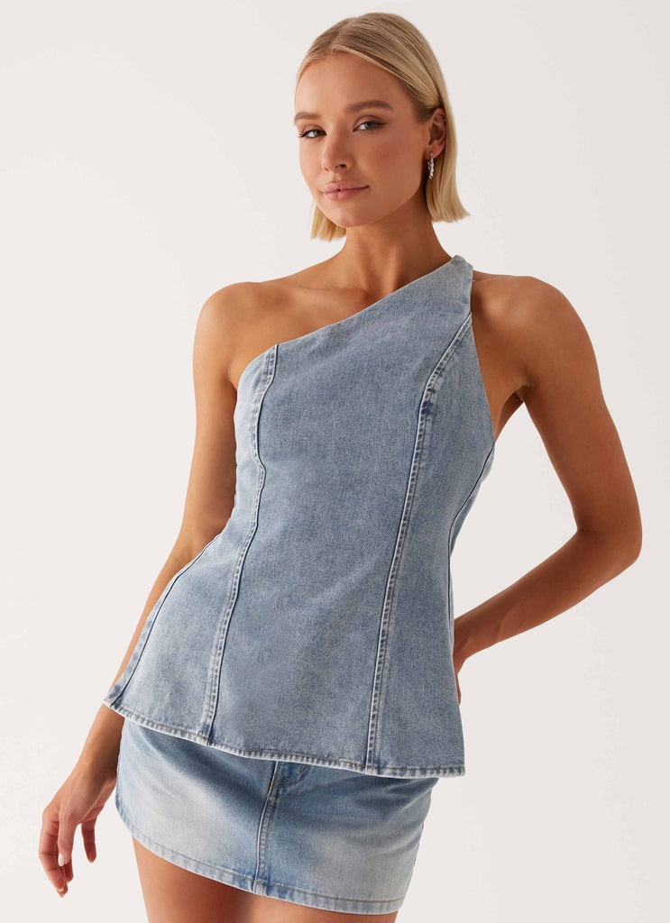 Womens Maysa Denim Top in the colour Blue in front of a light grey background