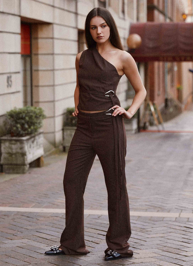 Womens Orla Fitted Flare Pants in the colour Chocolate in front of a light grey background