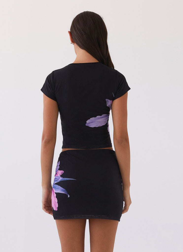 Womens Sunset Bliss Mesh Mini Skirt in the colour Cosmo Floral in front of a light grey background