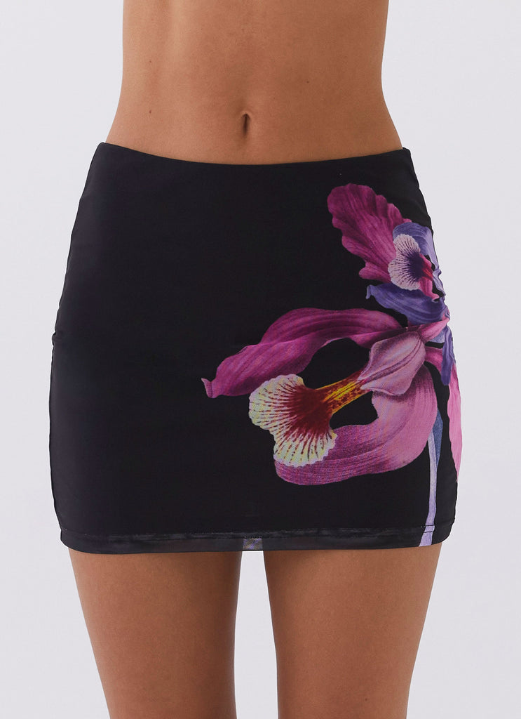 Womens Sunset Bliss Mesh Mini Skirt in the colour Cosmo Floral in front of a light grey background