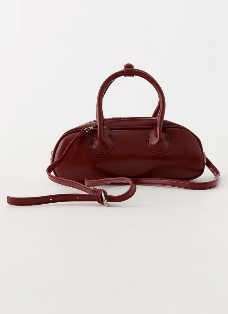 Womens Breanna Mini Bag in the colour Red in front of a light grey background