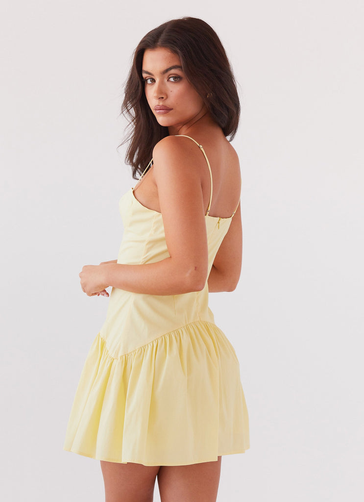 Womens Endless Summer Mini Dress in the colour Canary in front of a light grey background