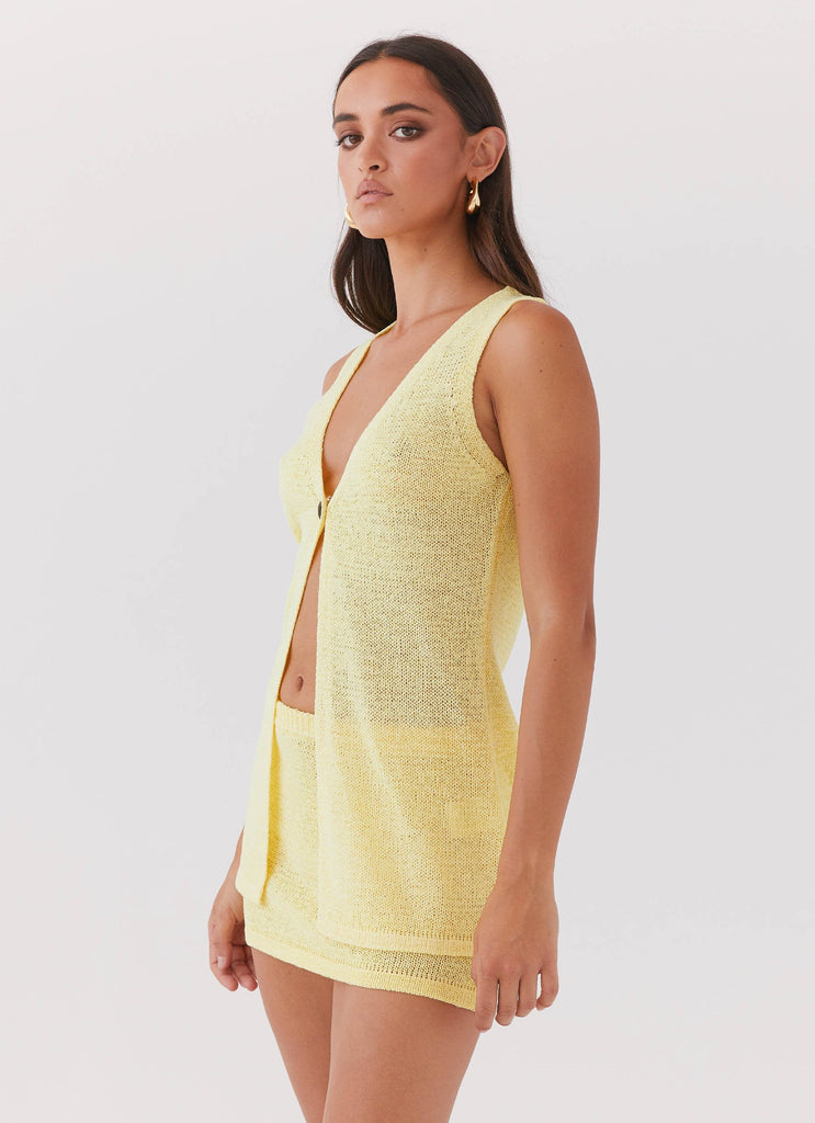 Womens Capri Glow Knit Top in the colour Canary in front of a light grey background