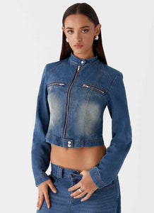 Womens Ride Elegant Denim Jacket in the colour Vintage Blue Wash in front of a light grey background