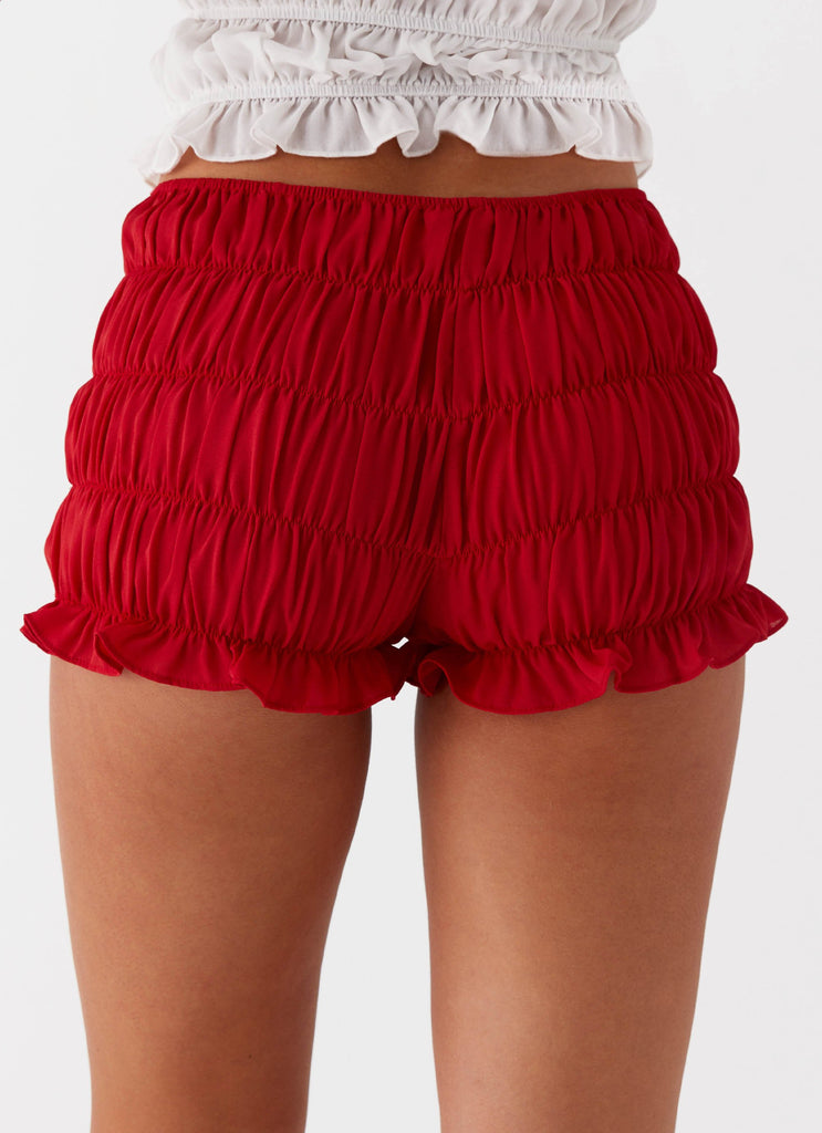 Womens Girls Like Us Ruched Mini Shorts in the colour Red in front of a light grey background