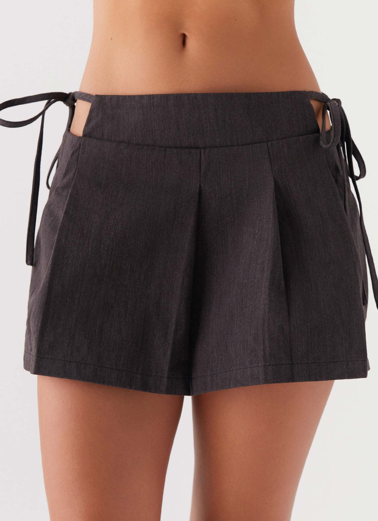 Womens Alexie Pleated Mini Skirt in the colour Black in front of a light grey background