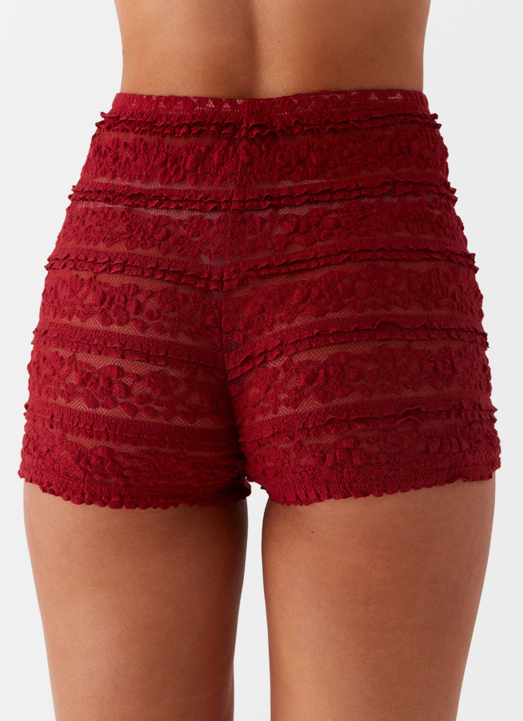 Womens Desert Isle Mini Shorts in the colour Red in front of a light grey background