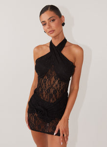 Womens Santana Crossover Lace Mini Dress in the colour Black in front of a light grey background