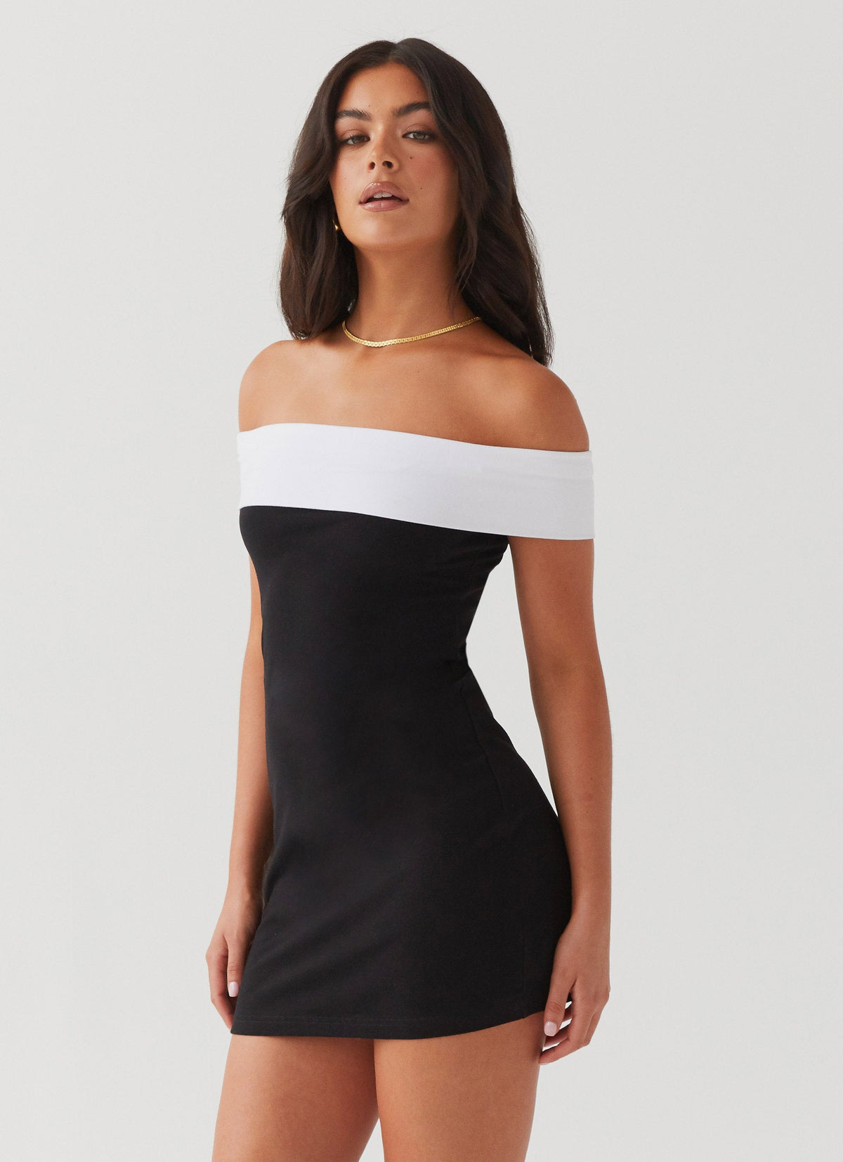 Womens Diamonds and Pearls Mini Dress in the colour Black in front of a light grey background