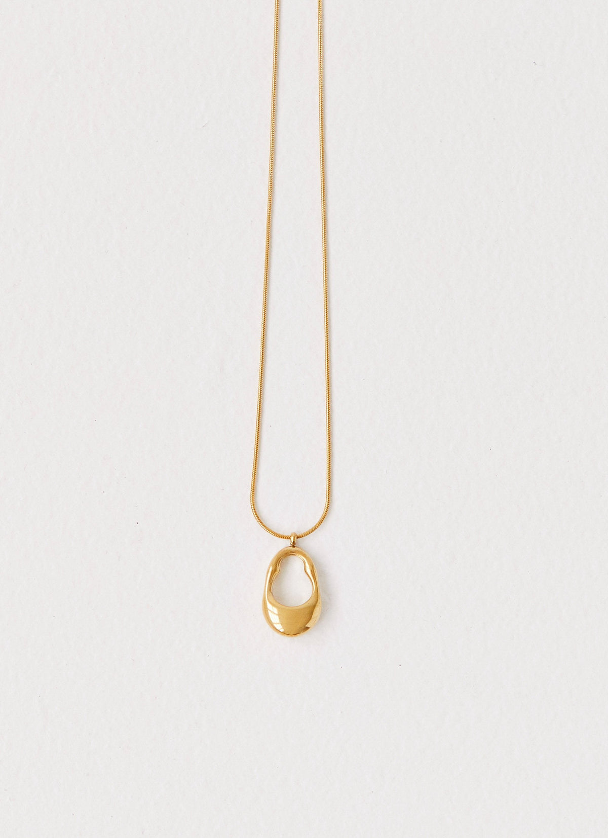 Womens Blissful Necklace in the colour Gold in front of a light grey background