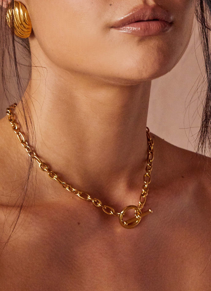 Womens Tally Chain Tin the colourBar Necklace in the colour Gold in front of a light grey background