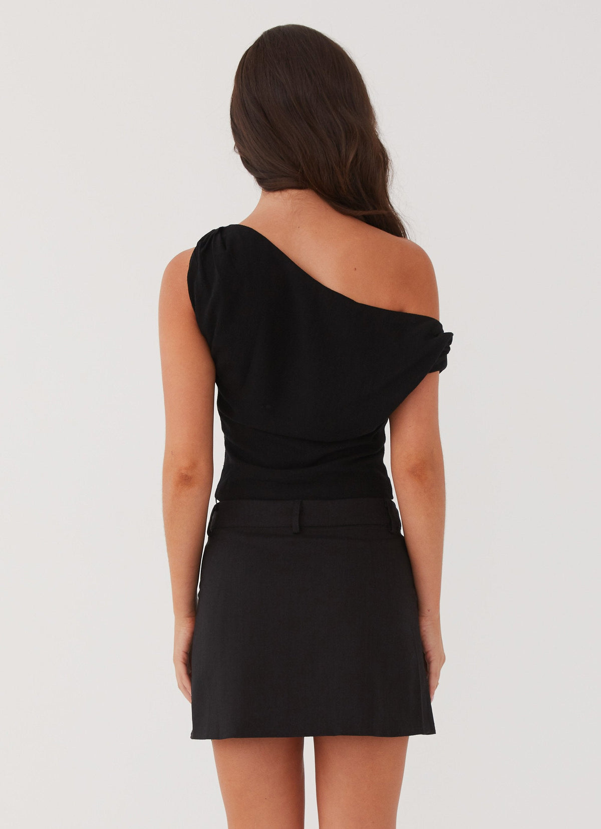 Womens Marissa Linen One Shoulder Top in the colour Black in front of a light grey background