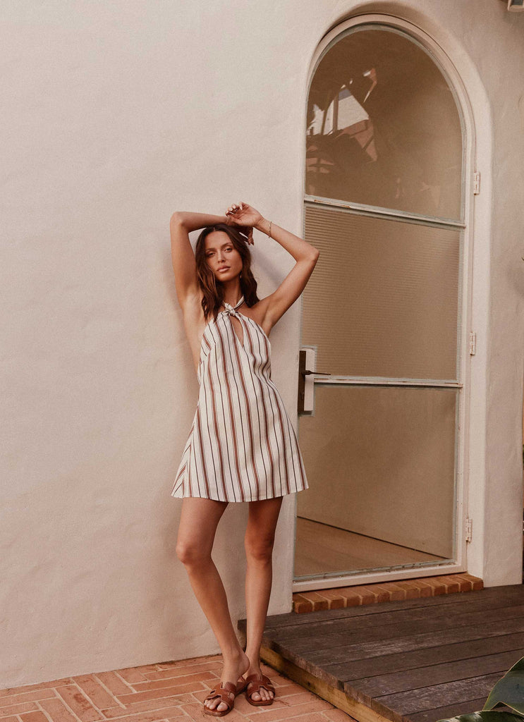 Womens Keira Linen Mini Dress in the colour Passionfruit Stripe in front of a light grey background