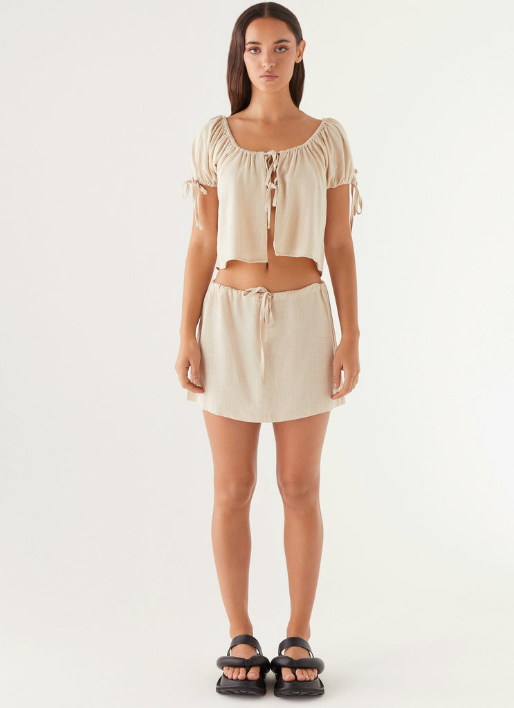 Womens Amber Fields Linen Mini Skirt in the colour Natural in front of a light grey background