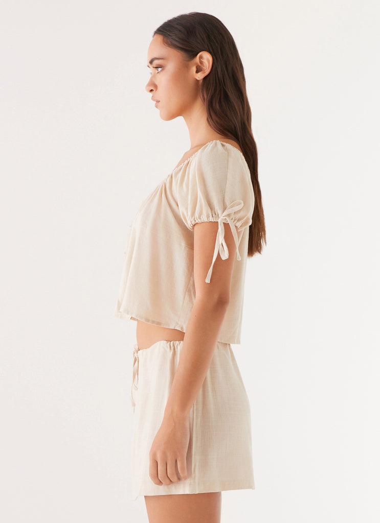 Womens Amber Fields Linen Mini Skirt in the colour Natural in front of a light grey background