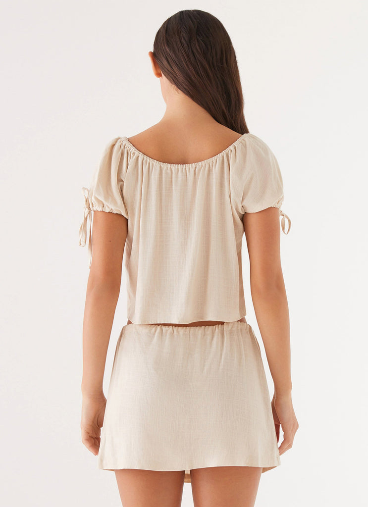 Womens Amber Fields Linen Mini Skirt in the colour Natural in front of a light grey background