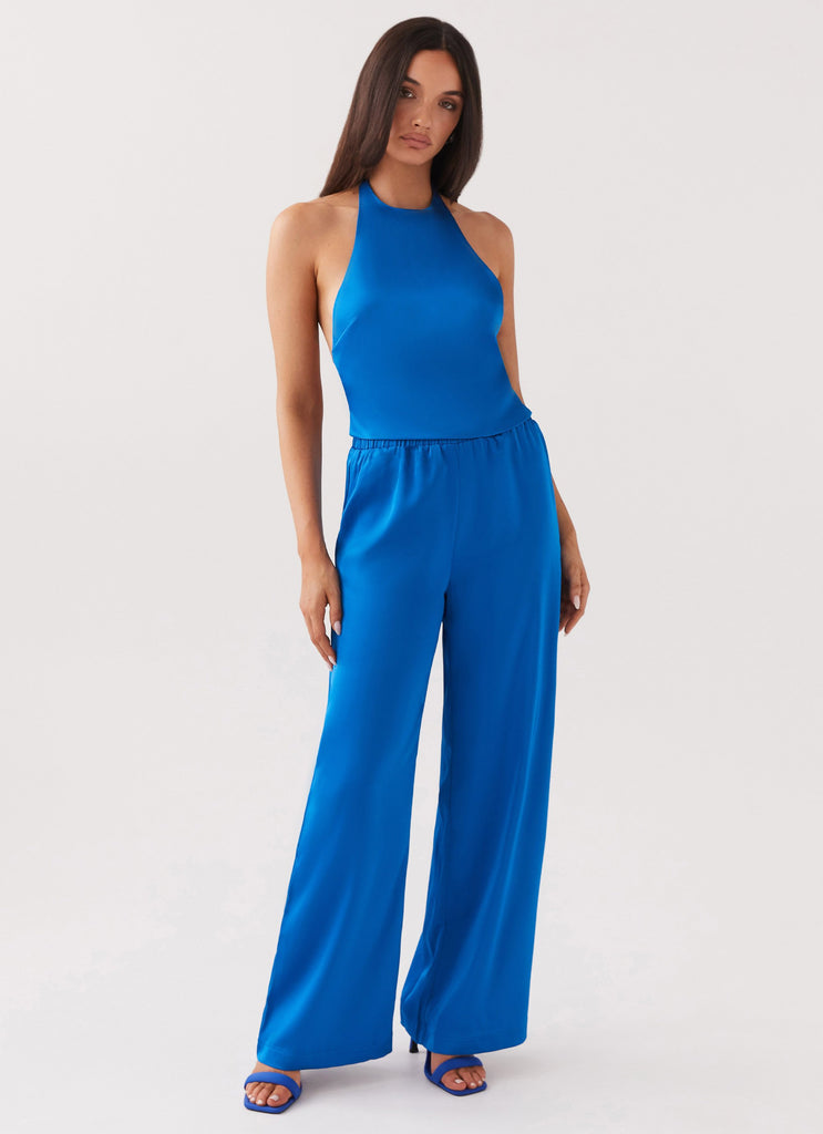 Womens Palm Cove Satin Pants in the colour Cobalt in front of a light grey background