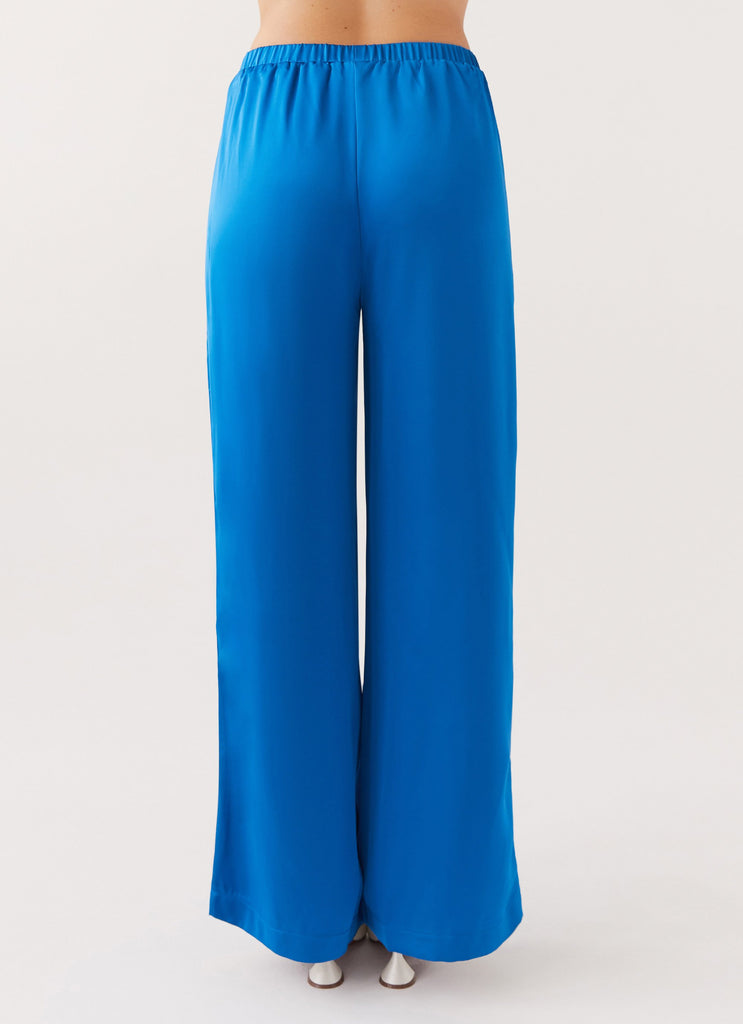 Womens Palm Cove Satin Pants in the colour Cobalt in front of a light grey background