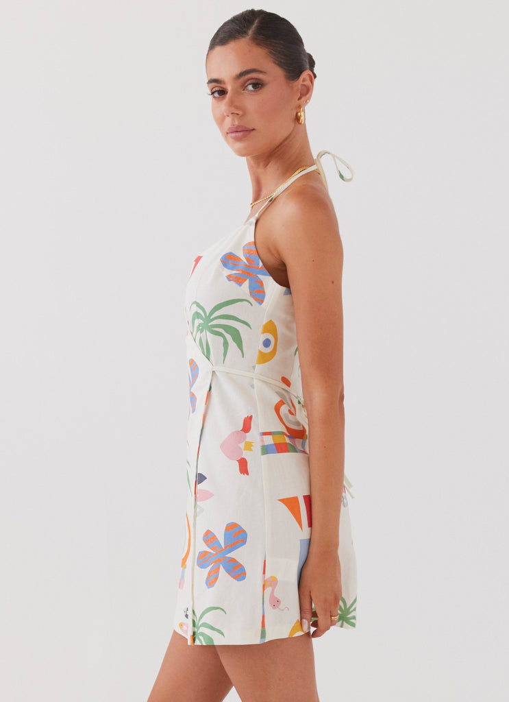 Womens At Last Sunrise Wrap Linen Mini Dress in the colour Summer Palm in front of a light grey background