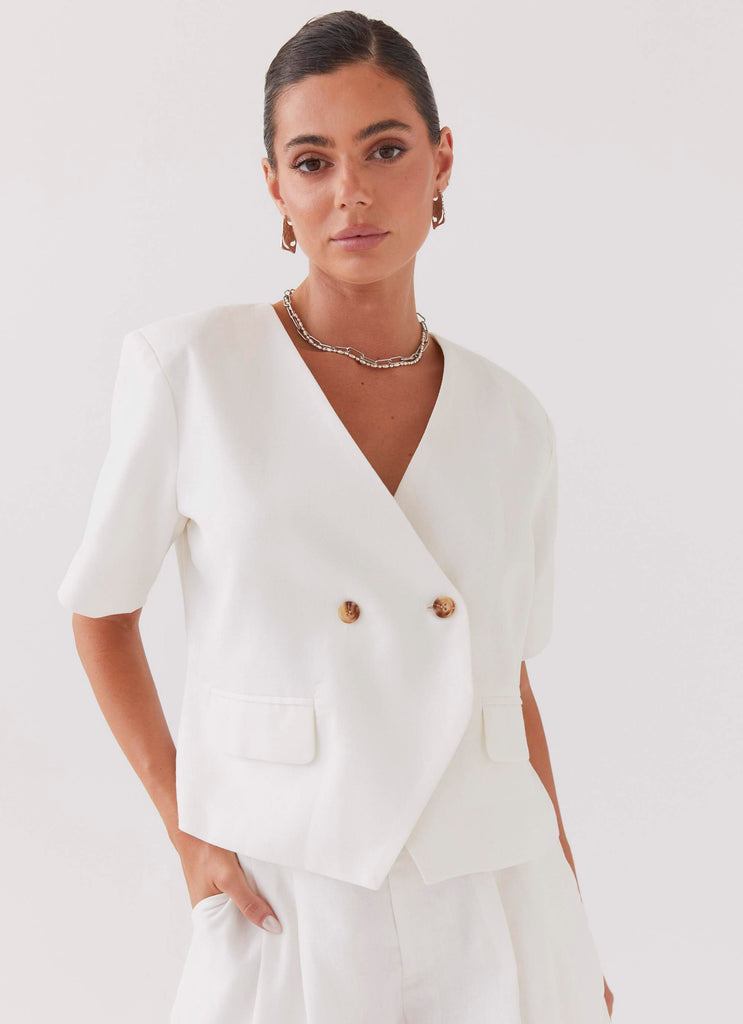 Womens Hacienda Linen Short Sleeve Blazer in the colour White in front of a light grey background