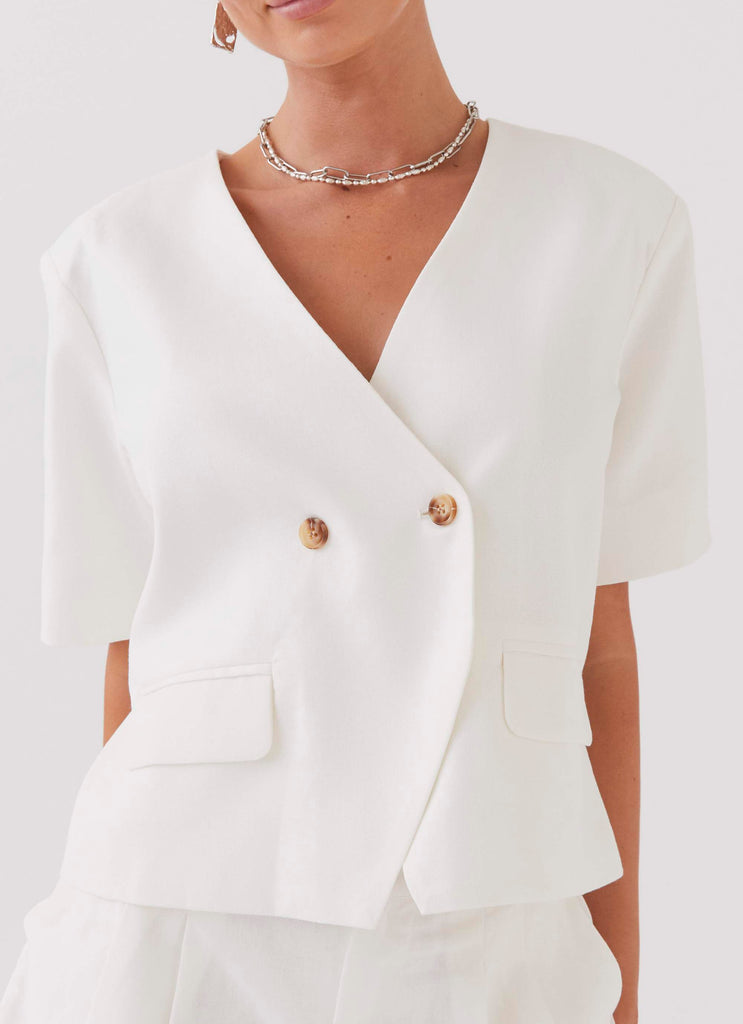 Womens Hacienda Linen Short Sleeve Blazer in the colour White in front of a light grey background