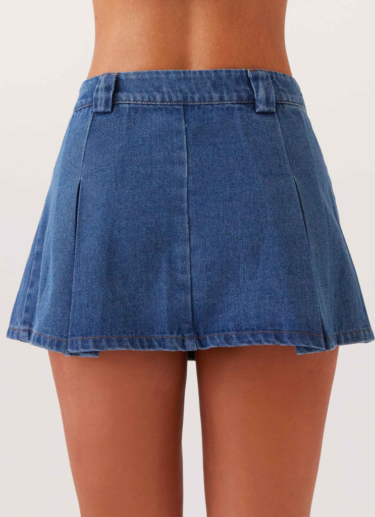 Womens Ashlyn Denim Mini Skirt in the colour Indigo in front of a light grey background