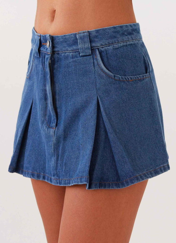 Womens Ashlyn Denim Mini Skirt in the colour Indigo in front of a light grey background