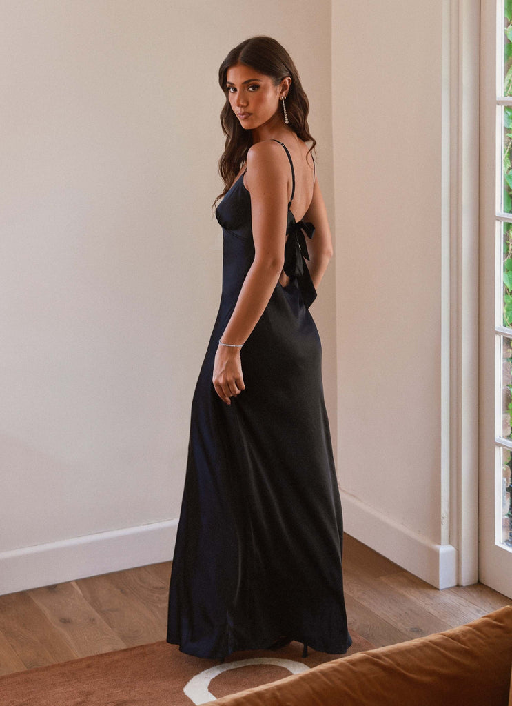 Womens Flora Satin Maxi Dress in the colour Midnight in front of a light grey background