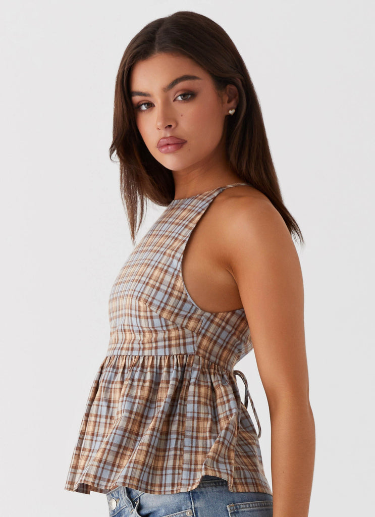 Womens Tanith Ruffle Top in the colour Brown Check in front of a light grey background